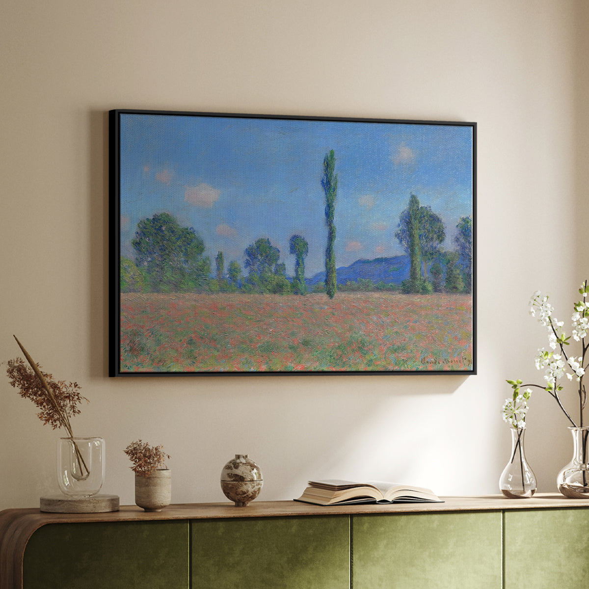 Black floater framed canvas of Poppy Field (Giverny), 1890-1891 by Claude Monet, featuring an impressionist landscape of blooming poppies in countryside above a sideboard in a softly lit hallway.