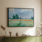 Black floater framed canvas of The Wheat Field (Champ de Blé), 1881 by Claude Monet, featuring an impressionist depiction of ripened grain field in countryside above a sideboard in a softly lit hallway.