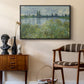 Banks of the Seine, Vétheuil, 1880 by Claude Monet as a black floater framed canvas featuring a tranquil riverside scene with houses and vegetation, styled above a mid-century console in a contemporary living area.