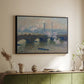 Black floater framed canvas of Waterloo Bridge, Gray Day, 1903 by Claude Monet, featuring an impressionist depiction of bridge with soft gray tones and haze above a sideboard in a softly lit hallway.