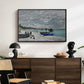 The Beach at Sainte-Adresse, 1867 by Claude Monet displayed in a black floater framed canvas above a dark wood credenza in an entryway.