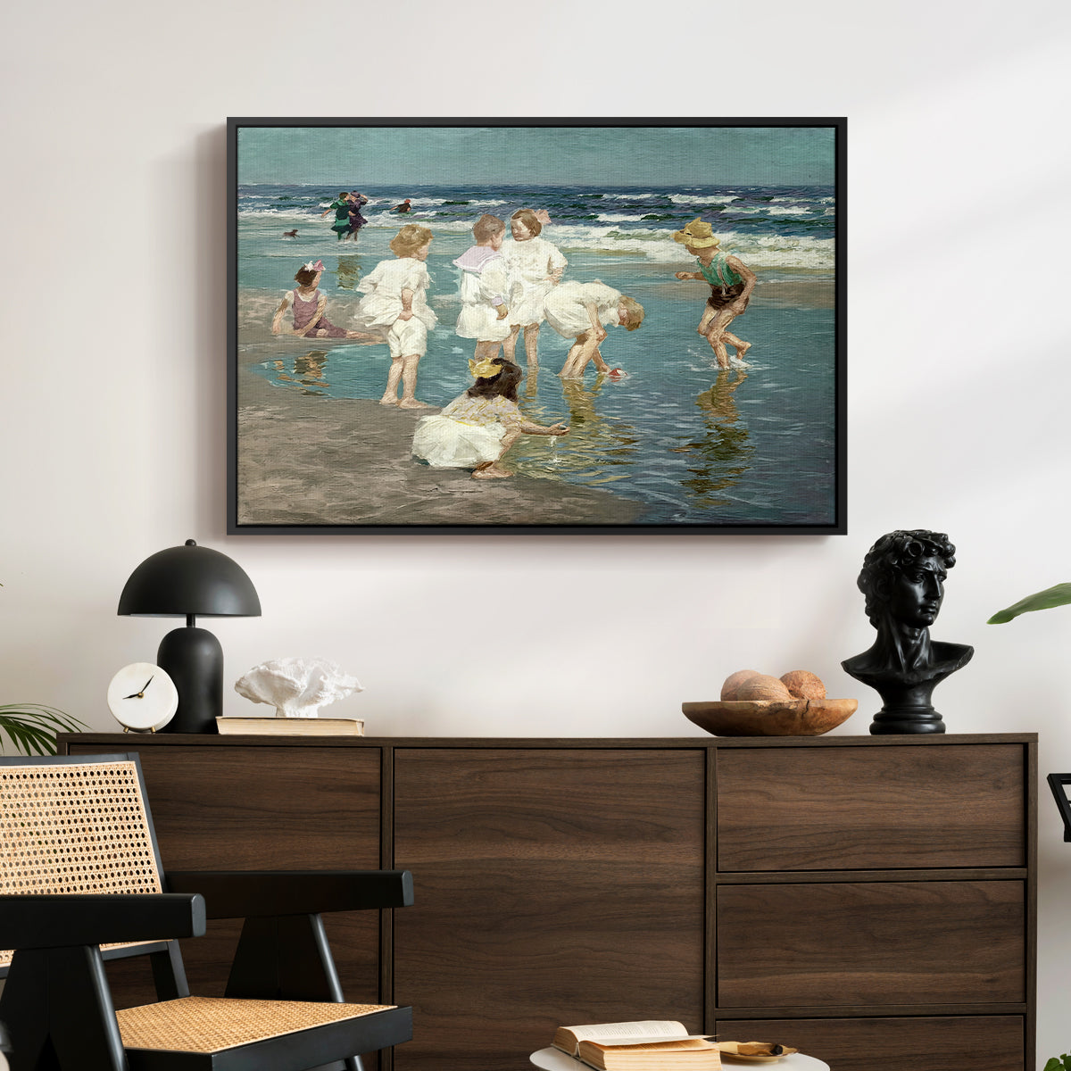 A Holiday, c. 1915 by Edward Henry Potthast displayed in a black floater framed canvas above a dark wood credenza in an entryway.