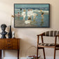 A Holiday, c. 1915 by Edward Henry Potthast as a black floater framed canvas featuring an impressionist coastal view of families enjoying seaside water, styled above a mid-century console in a contemporary living area.
