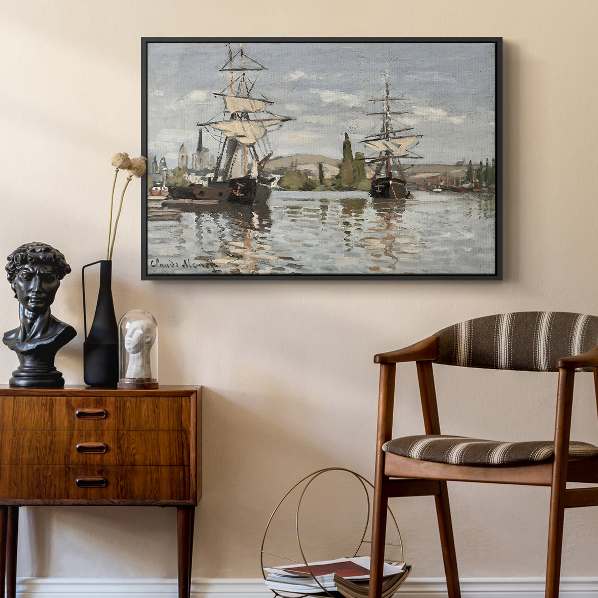 Ships Riding on the Seine at Rouen, 1872 by Claude Monet as a black floater framed canvas featuring a harbor view with tall ships lining the waterfront in muted tones, styled above a mid-century console in a contemporary living area.