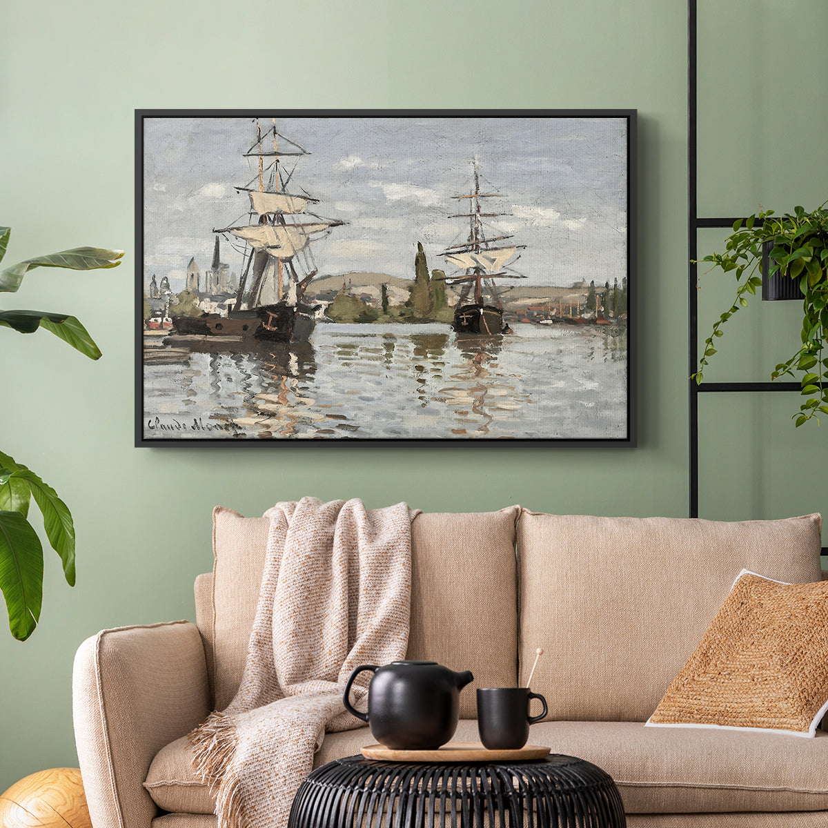 Black floater framed canvas featuring a nautical landscape with vessels resting on calm water, displayed above a sofa in a modern living room.
