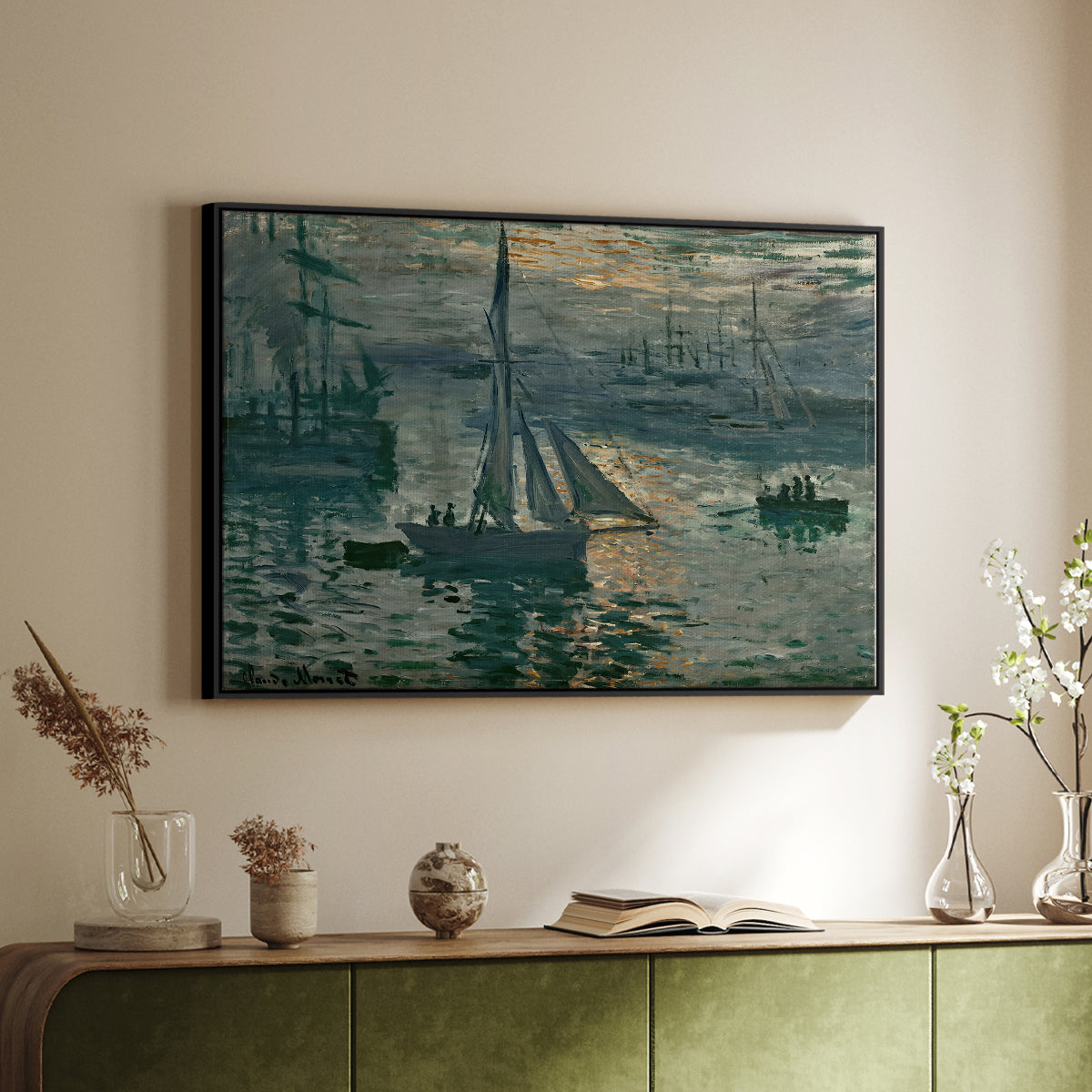 Black floater framed canvas of Sunrise (Marine), 1873 by Claude Monet, featuring an impressionist seascape with glowing sun and misty water above a sideboard in a softly lit hallway.