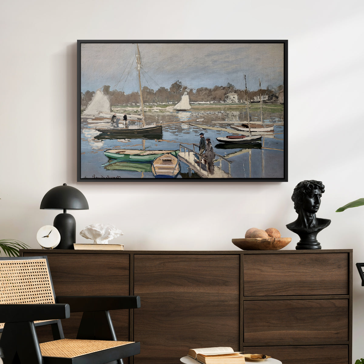 The Basin at Argenteuil, 1874 by Claude Monet displayed in a black floater framed canvas above a dark wood credenza in an entryway.
