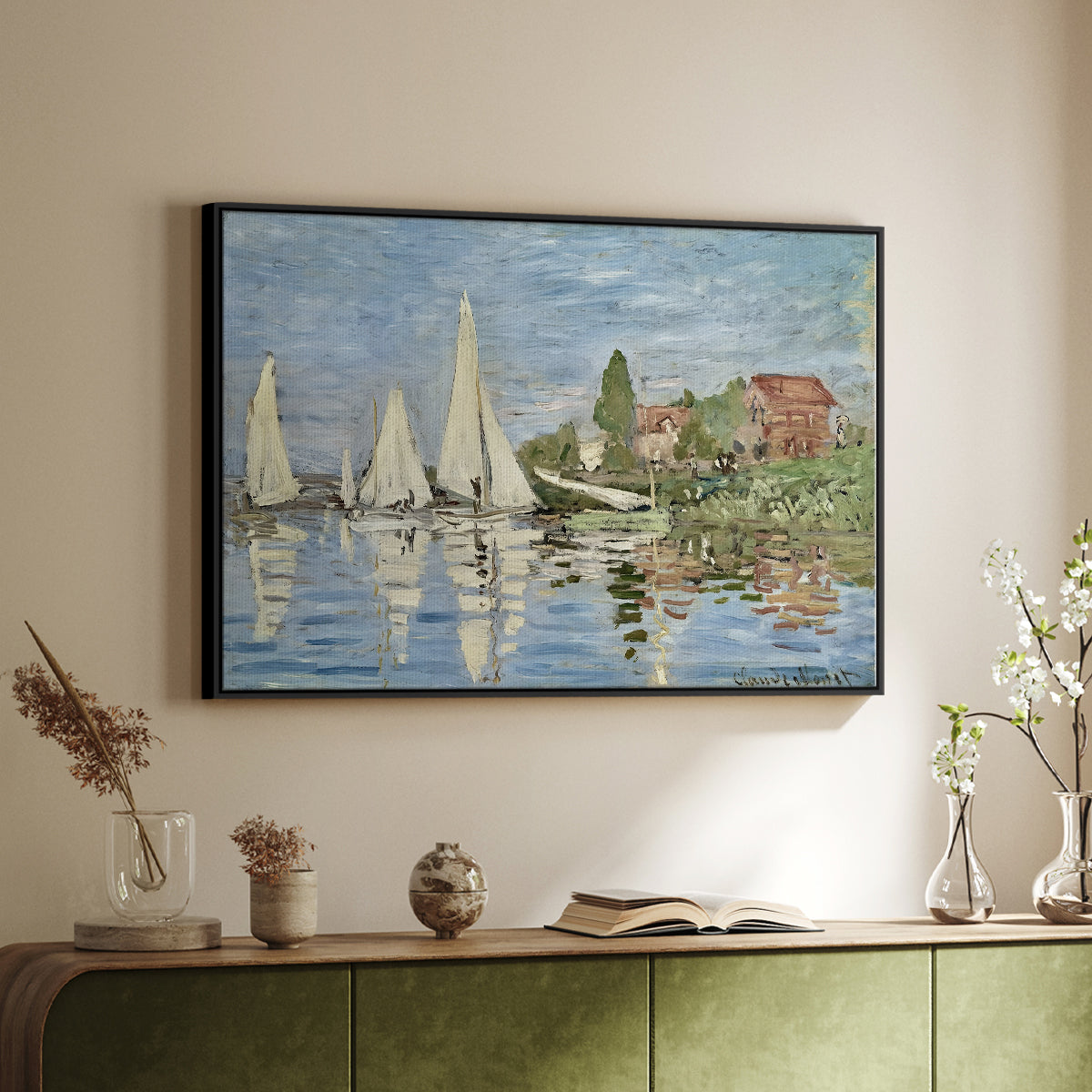 Black floater framed canvas of Regatta at Argenteuil, 1872 by Claude Monet, featuring a lively regatta scene with multiple boats and fluttering sails above a sideboard in a softly lit hallway.
