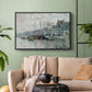 Black floater framed canvas featuring a harbor view with masts, houses, and reflections in water, displayed above a sofa in a modern living room.
