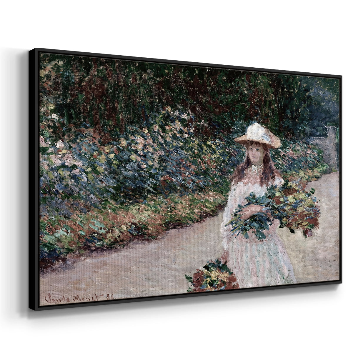Angled view of Young Girl in the Garden at Giverny, 1888 by Claude Monet in a black floater framed canvas.