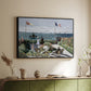 Black floater framed canvas of Garden at Sainte-Adresse, 1867 by Claude Monet, featuring an impressionist coastal garden with people and ocean view above a sideboard in a softly lit hallway.