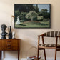 Woman in the Garden, Sainte-Adresse, 1867 by Claude Monet as a black floater framed canvas featuring an elegant woman posed outdoors among blooming plants, styled above a mid-century console in a contemporary living area.