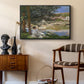 On the Bank of the Seine, Bennecourt, 1868 by Claude Monet as a black floater framed canvas featuring an impressionist landscape with people relaxing along the Seine, styled above a mid-century console in a contemporary living area.