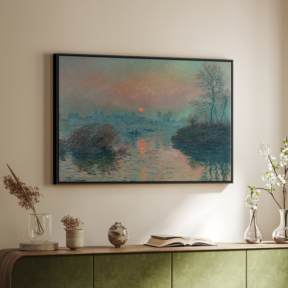 Black floater framed canvas of Sunset on the Seine at Lavacourt, Winter Effect, 1880 by Claude Monet, featuring a winter scene with warm light reflecting on water at dusk above a sideboard in a softly lit hallway.