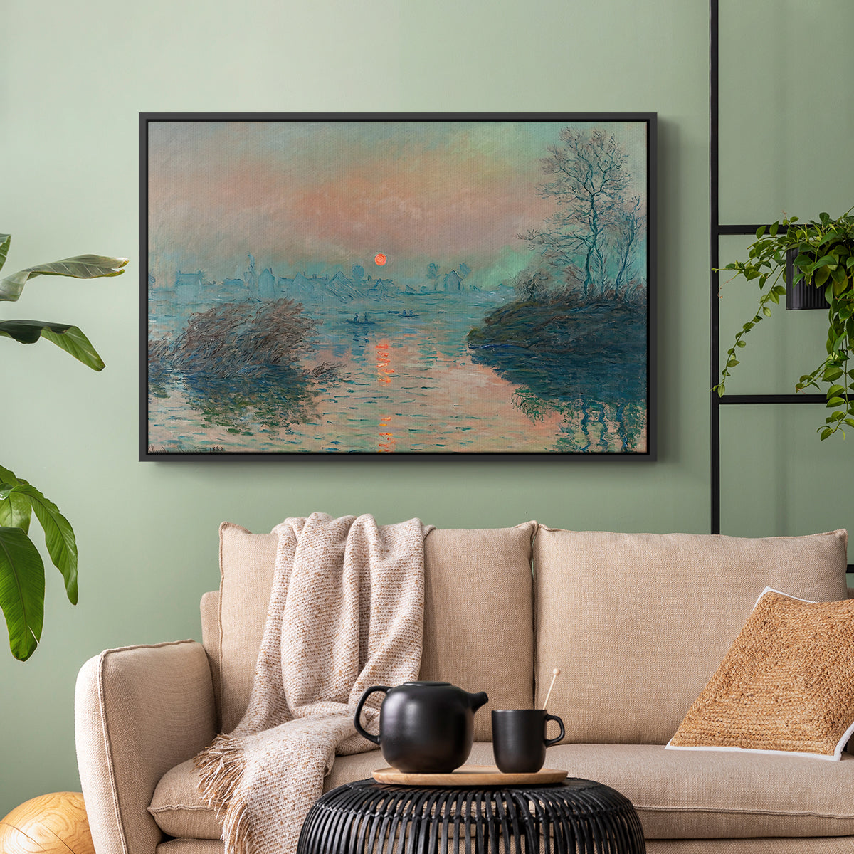Black floater framed canvas featuring an atmospheric landscape combining cold tones and warm sky, displayed above a sofa in a modern living room.