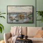 Black floater framed canvas featuring a subdued urban landscape with structure spanning river, displayed above a sofa in a modern living room.