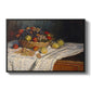 Still Life with Apples and Grapes, 1880 by Claude Monet in a black floater framed canvas wall art display.