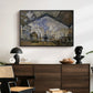 The Gare Saint-Lazare, 1877 by Claude Monet displayed in a black floater framed canvas above a dark wood credenza in an entryway.