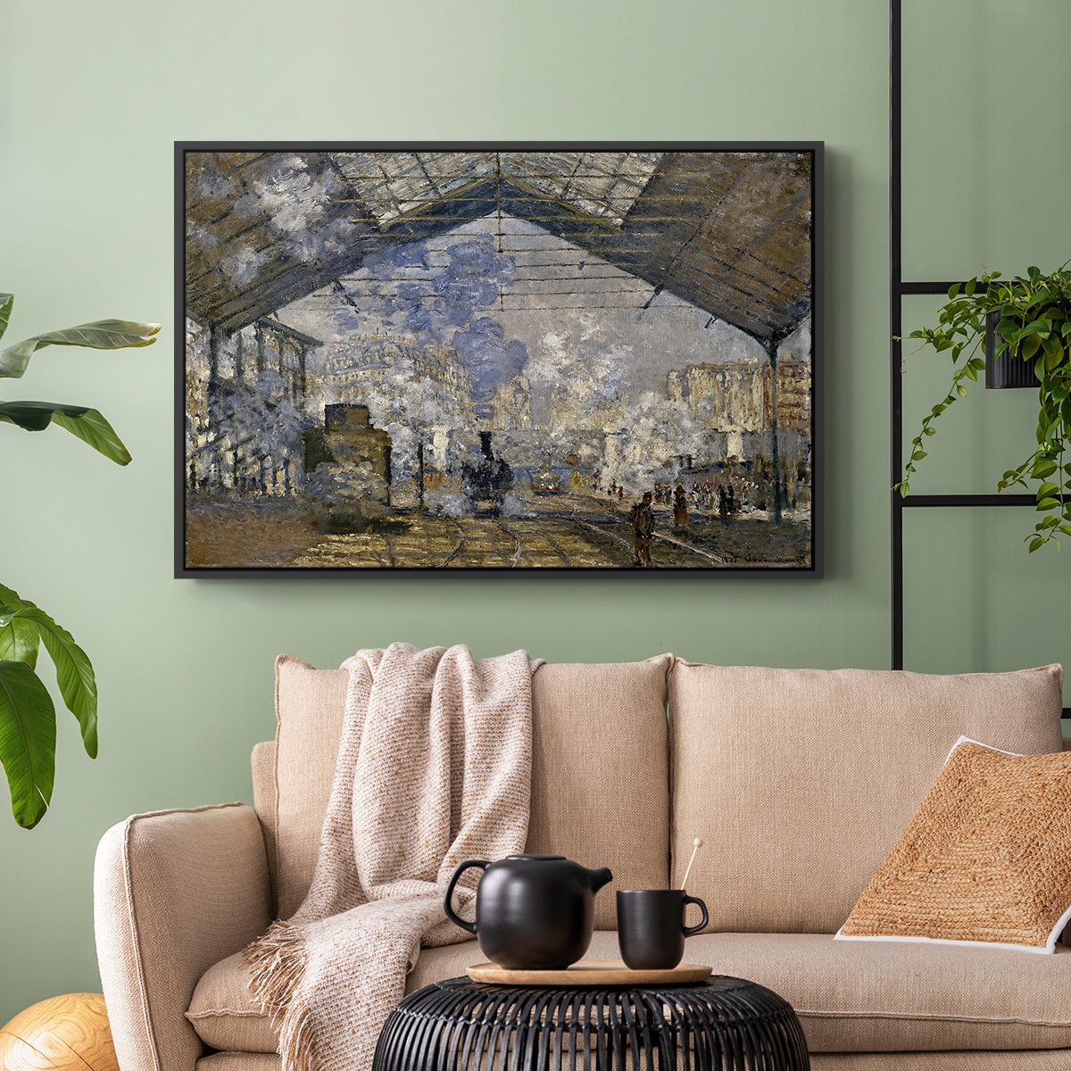 Black floater framed canvas featuring a bustling transport hub with trains beneath glass roof, displayed above a sofa in a modern living room.