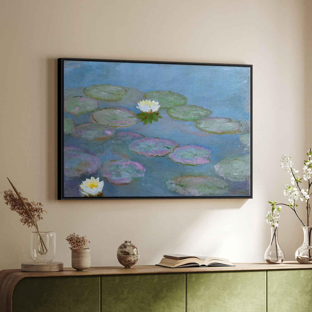 Black floater framed canvas of Water Lilies (Nymphéas), 1897-1899 by Claude Monet, featuring an impressionist pond scene with lily pads and soft reflections above a sideboard in a softly lit hallway.