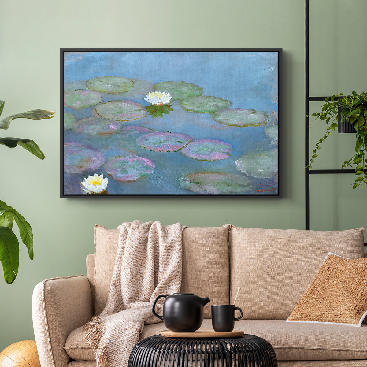 Black floater framed canvas featuring a close-up of aquatic plants in still water, displayed above a sofa in a modern living room.