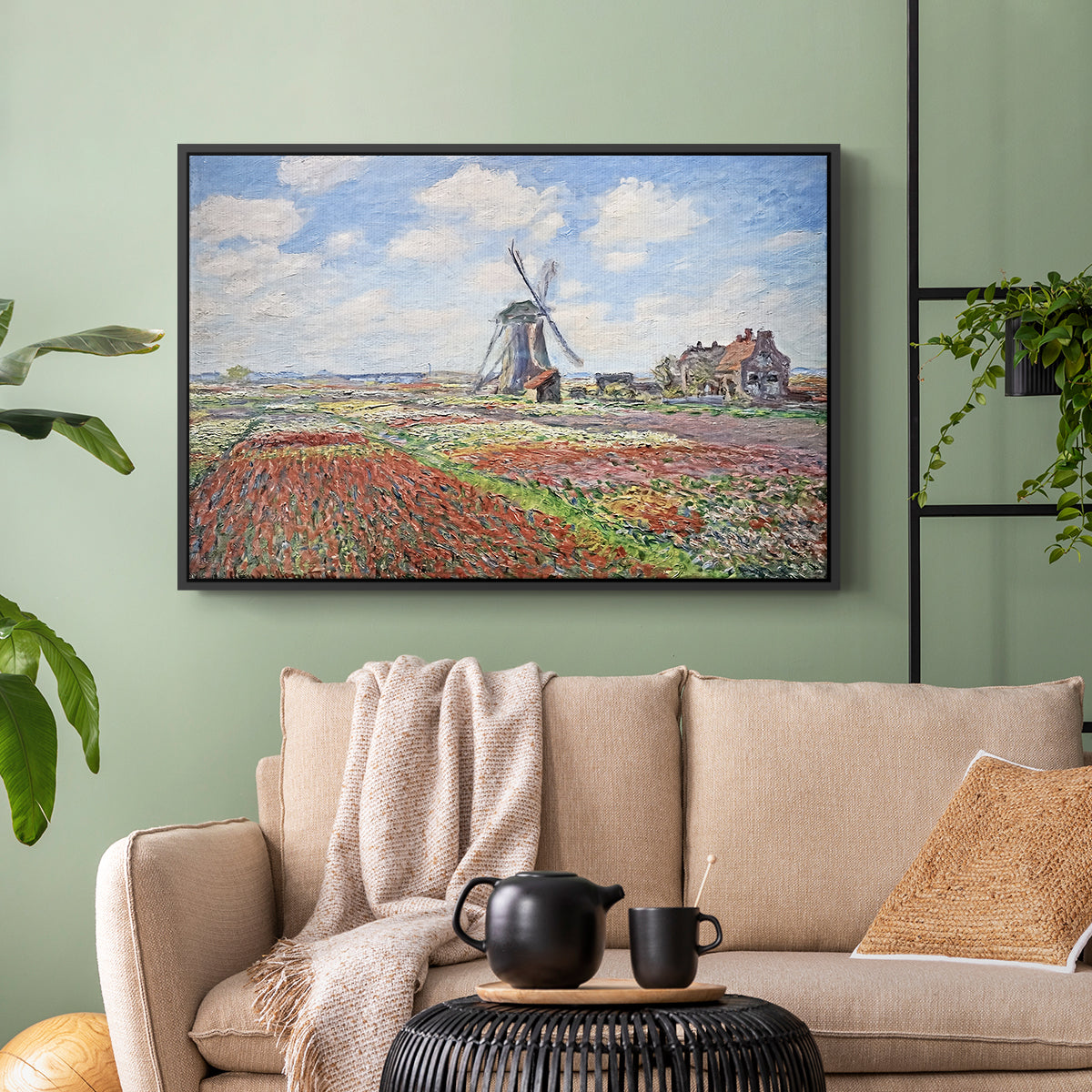 Black floater framed canvas featuring a rural scene with patterned rows of flowers and windmill, displayed above a sofa in a modern living room.