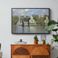 Houses on the Zaan River at Zaandam, 1871 by Claude Monet in a black floater framed canvas featuring a row of houses along river with reflections in calm water, displayed above a wood console cabinet.