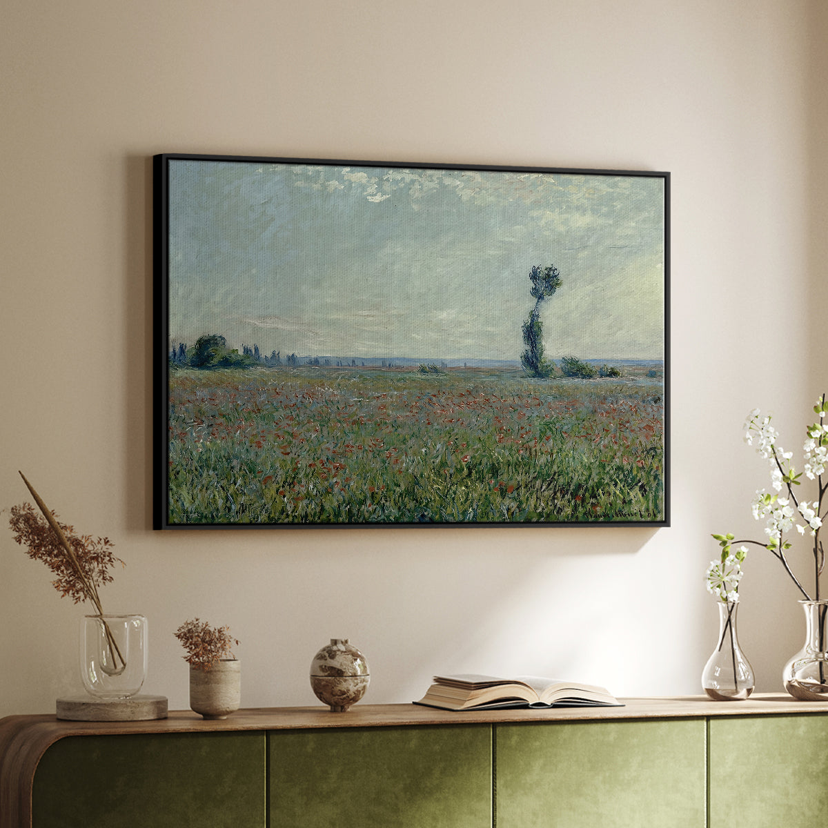 Black floater framed canvas of Poppy Field, 1881 by Claude Monet, featuring an impressionist landscape filled with blooming flowers and greenery above a sideboard in a softly lit hallway.