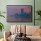Black floater framed canvas featuring a dramatic skyline with reflections under colorful sky, displayed above a sofa in a modern living room.