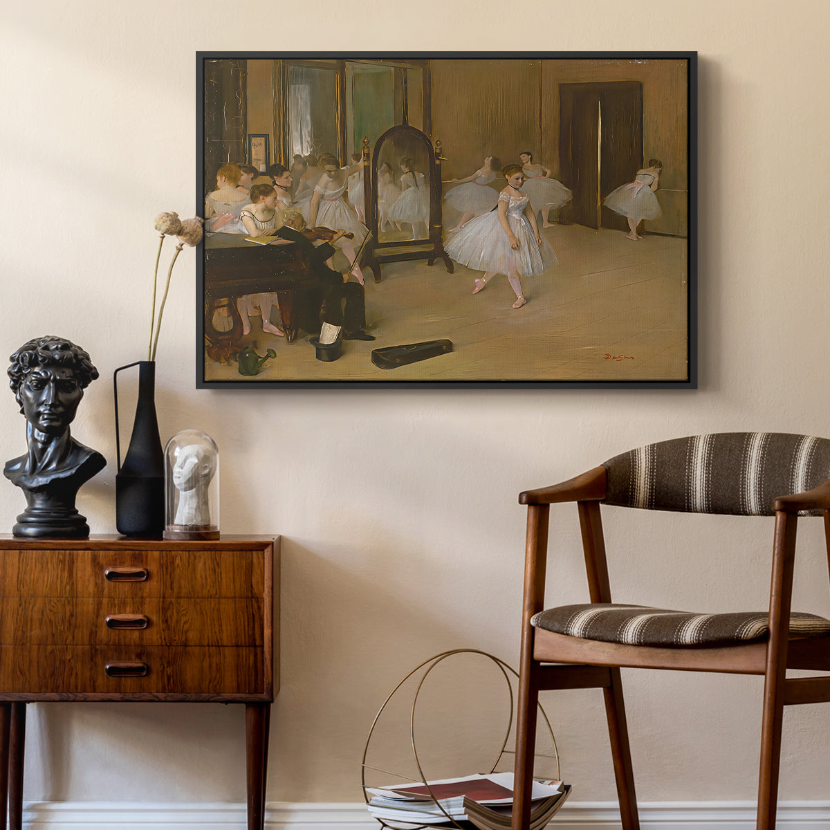 The Dancing Class, c. 1870 by Edgar Degas as a black floater framed canvas featuring an impressionist interior capturing movement and discipline of dancers, styled above a mid-century console in a contemporary living area.