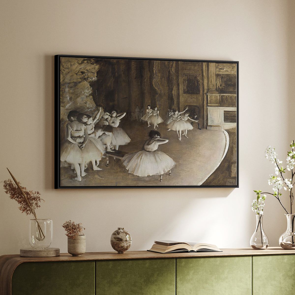 Black floater framed canvas of The Rehearsal of the Ballet Onstage, 1874 by Edgar Degas, featuring a stage rehearsal scene with dancers preparing performance above a sideboard in a softly lit hallway.