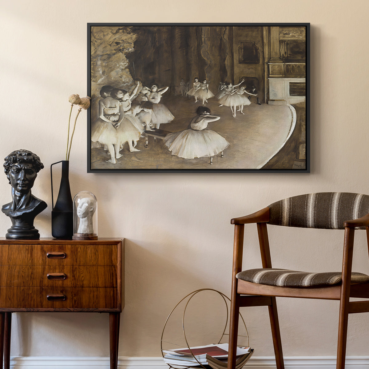 The Rehearsal of the Ballet Onstage, 1874 by Edgar Degas as a black floater framed canvas featuring an impressionist depiction of ballet practice on theater stage, styled above a mid-century console in a contemporary living area.