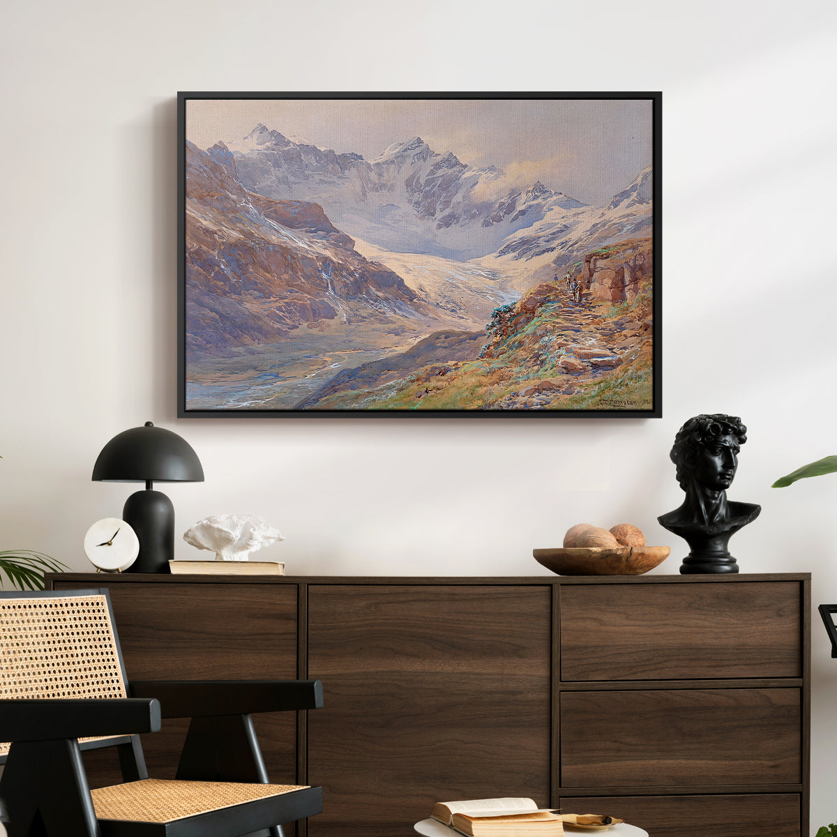 Odenwinklkees with the Johannisberg, 1902 by Edward Theodore Compton displayed in a black floater framed canvas above a dark wood credenza in an entryway.