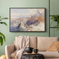 Black floater framed canvas featuring a rugged mountain pass scene with distant peaks, displayed above a sofa in a modern living room.
