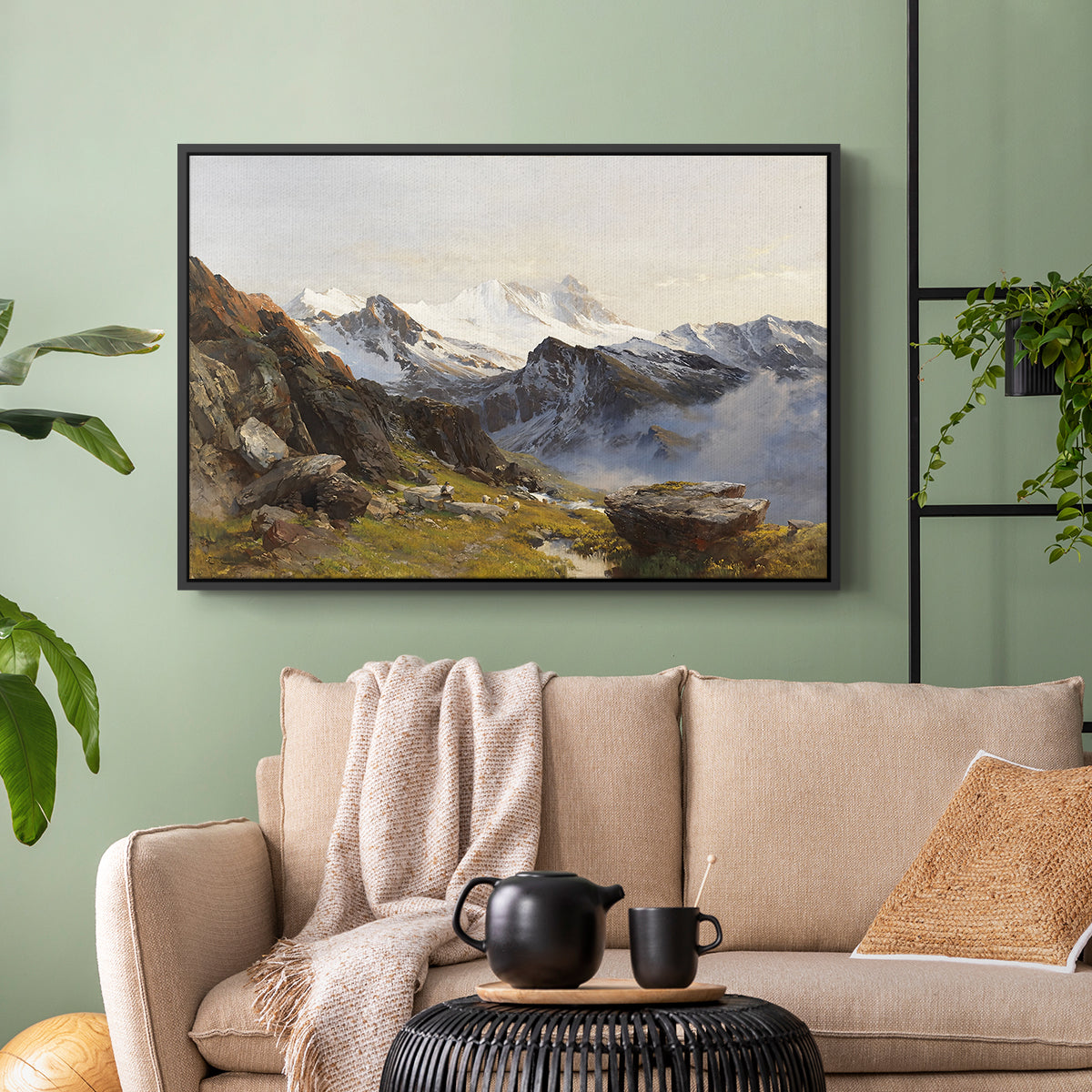 Black floater framed canvas featuring a scenic mountain view with dramatic elevation and depth, displayed above a sofa in a modern living room.