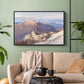 Black floater framed canvas featuring an expansive mountainous landscape with natural depth, displayed above a sofa in a modern living room.