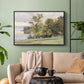 Black floater framed canvas featuring a tranquil lakeside view with soft atmospheric tones, displayed above a sofa in a modern living room.