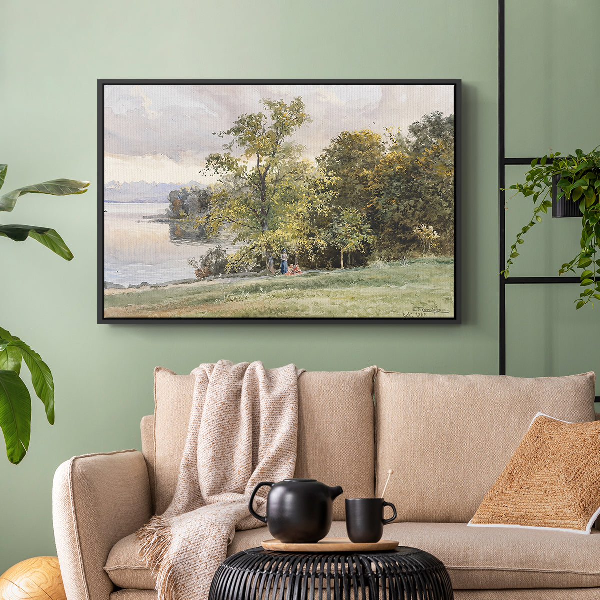 Black floater framed canvas featuring a tranquil lakeside view with soft atmospheric tones, displayed above a sofa in a modern living room.