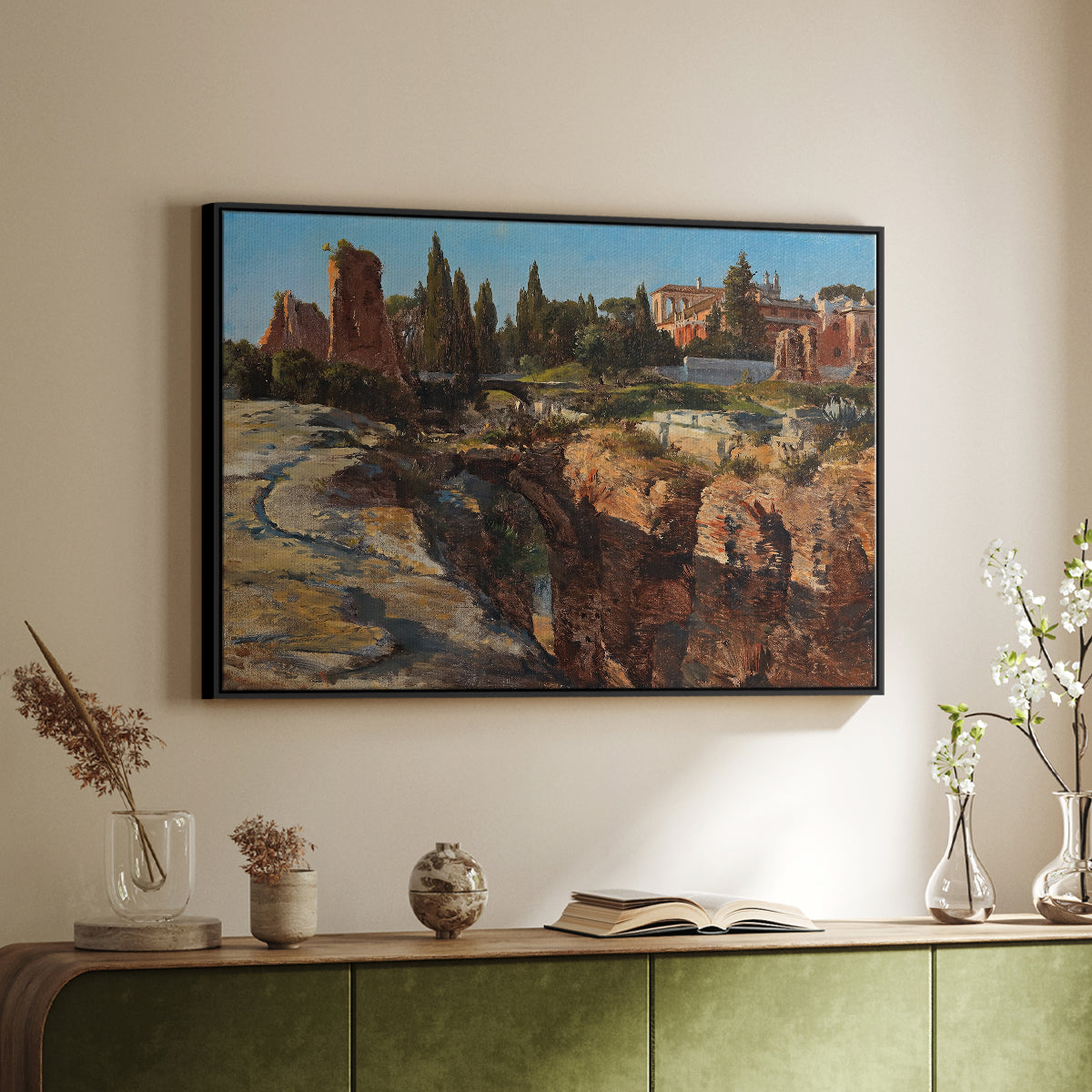 Black floater framed canvas of Palatine in Rome, c. 1921 by Edward Theodore Compton, featuring an architectural scene of ancient structures in sunlit environment above a sideboard in a softly lit hallway.