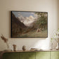 Black floater framed canvas of Landscape in the Caucasus, c. 1921 by Edward Theodore Compton, featuring an expansive view of Caucasus mountains under open sky above a sideboard in a softly lit hallway.