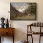 Landscape in the Caucasus, c. 1921 by Edward Theodore Compton as a black floater framed canvas featuring a natural scene with valleys and rocky formations, styled above a mid-century console in a contemporary living area.