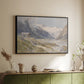 Black floater framed canvas of Shepherds (Pasterze), c. 1921 by Edward Theodore Compton, featuring a pastoral mountain scene with figures tending livestock above a sideboard in a softly lit hallway.