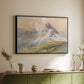 Black floater framed canvas of From the Dolomites, 1904 by Edward Theodore Compton, featuring an alpine scene with jagged rock formations and distant mountains above a sideboard in a softly lit hallway.