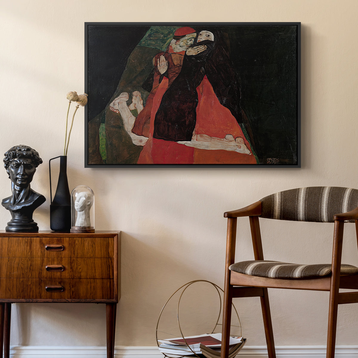 Cardinal and Nun (Caress), 1912 by Egon Schiele as a black floater framed canvas featuring an expressive painting of figures entwined with bold lines and color, styled above a mid-century console in a contemporary living area.