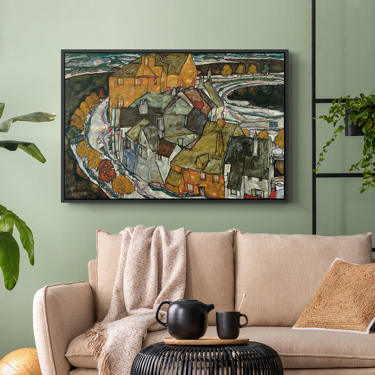 Black floater framed canvas featuring an architectural scene with houses arranged in curved composition, displayed above a sofa in a modern living room.