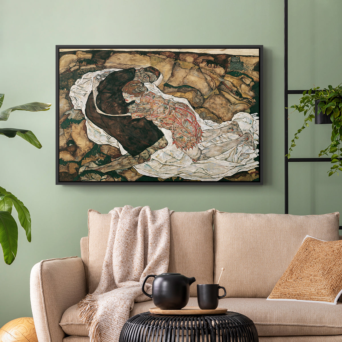 Black floater framed canvas featuring an intense composition exploring life and death through figures, displayed above a sofa in a modern living room.