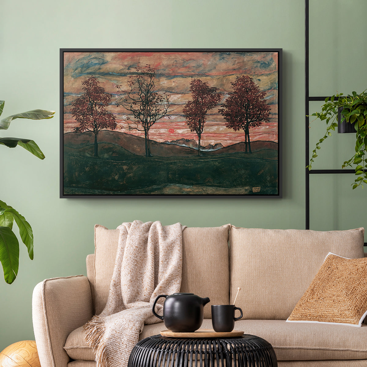 Black floater framed canvas featuring an expressionist landscape featuring isolated trees in field, displayed above a sofa in a modern living room.