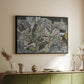 Black floater framed canvas of Mödling II, 1918 by Egon Schiele, featuring an expressionist cityscape with tightly packed buildings and bold lines above a sideboard in a softly lit hallway.