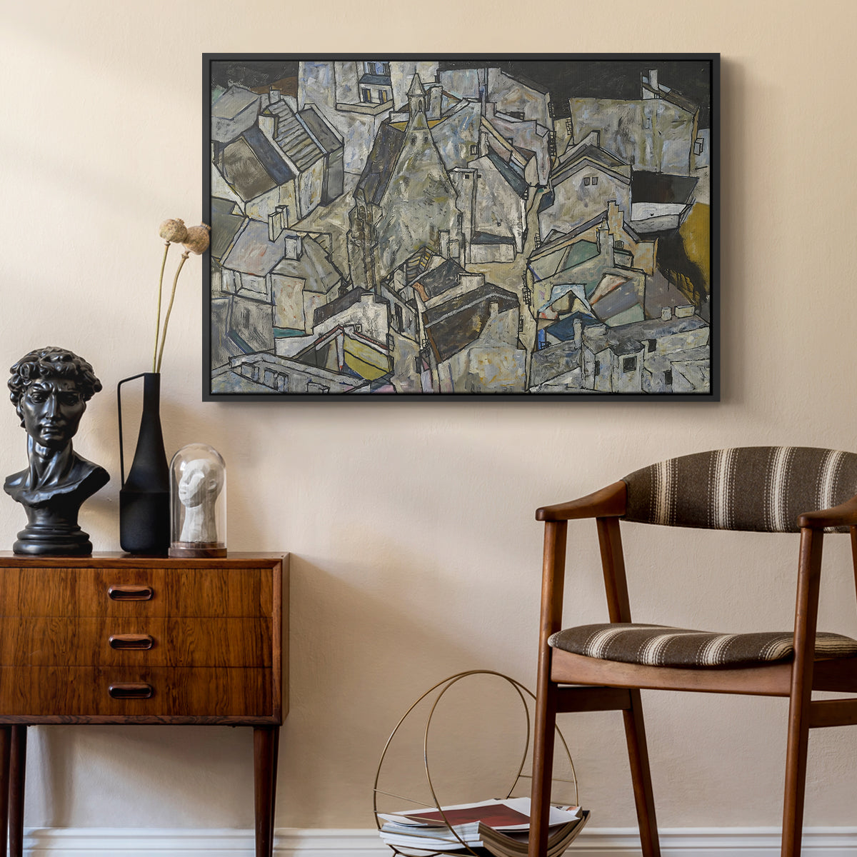 Mödling II, 1918 by Egon Schiele as a black floater framed canvas featuring an abstracted town view with angular rooftops and fragmented forms, styled above a mid-century console in a contemporary living area.