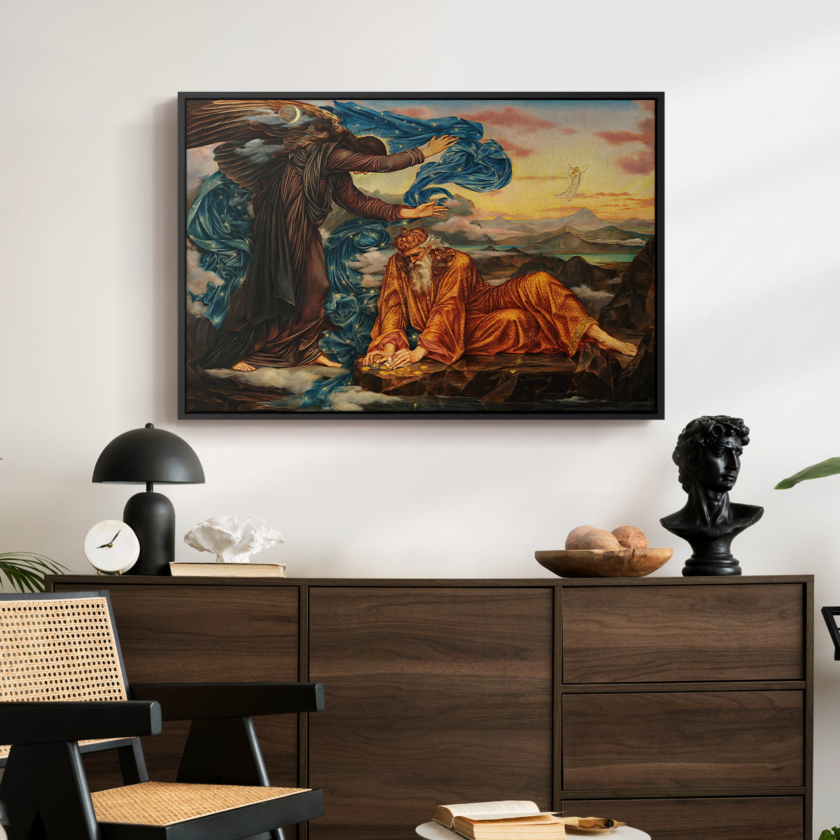 Earthbound, 1897 by Evelyn De Morgan displayed in a black floater framed canvas above a dark wood credenza in an entryway.